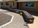 The front yard features unique and distinctive desert landscaping with decorative features at 11415 N 110Th Dr, Sun City, AZ 85351