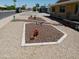Beautifully landscaped front yard with desert landscaping, granite and unique metal art at 11415 N 110Th Dr, Sun City, AZ 85351