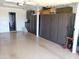 Garage has epoxy floors and extensive built-in storage cabinets at 11415 N 110Th Dr, Sun City, AZ 85351