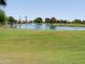 Picturesque golf course with calm lake and lush green grass providing a peaceful and recreational outdoor setting at 11415 N 110Th Dr, Sun City, AZ 85351