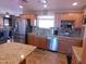 Updated kitchen featuring stainless steel appliances, granite countertops, and tiled backsplash at 11415 N 110Th Dr, Sun City, AZ 85351