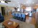 Bright kitchen with stainless appliances, a large island with cooktop, and views to the dining area at 11415 N 110Th Dr, Sun City, AZ 85351