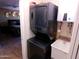 A compact laundry room features a stacked washer/dryer and utility sink at 11415 N 110Th Dr, Sun City, AZ 85351