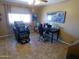 Bright office space with a massage chair, desk setup, and natural light at 11415 N 110Th Dr, Sun City, AZ 85351
