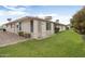 Private backyard boasts a grassy area with potential for outdoor activities at 12542 W Parkwood Dr, Sun City West, AZ 85375