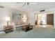 Inviting living room with carpet, neutral decor and sliding glass door at 12542 W Parkwood Dr, Sun City West, AZ 85375