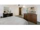 Spacious main bedroom features mirrored dresser and classic carpet at 12542 W Parkwood Dr, Sun City West, AZ 85375