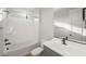 Modern bathroom featuring a shower-tub combo, gray vanity, sleek black fixtures, and new toilet at 13551 W Calle De Baca --, Peoria, AZ 85383