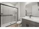 Sleek bathroom with glass-enclosed shower, modern vanity, and matte black fixtures at 13551 W Calle De Baca --, Peoria, AZ 85383
