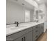 Modern bathroom featuring a double vanity with quartz countertop and sleek black hardware at 13551 W Calle De Baca --, Peoria, AZ 85383