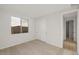 Bright bedroom with carpet flooring, closet with sliding doors, and a window view at 13551 W Calle De Baca --, Peoria, AZ 85383