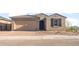 Charming single-story home featuring a two-car garage, neutral stucco, and low-maintenance desert landscaping at 13551 W Calle De Baca --, Peoria, AZ 85383