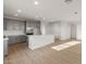 Modern kitchen with an island, gray cabinets, stainless appliances and lots of light at 13551 W Calle De Baca --, Peoria, AZ 85383