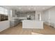 Bright and airy kitchen features stainless steel appliances, gray cabinets, a large island, and tile backsplash at 13551 W Calle De Baca --, Peoria, AZ 85383
