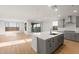 Modern kitchen boasts gray cabinetry, stainless appliances, and a large island with white countertops and a built-in sink at 13551 W Calle De Baca --, Peoria, AZ 85383