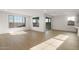 Spacious living area with lots of natural light from large windows and sliding glass doors at 13551 W Calle De Baca --, Peoria, AZ 85383