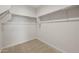 A spacious walk-in closet featuring built-in shelving and ample storage space at 13551 W Calle De Baca --, Peoria, AZ 85383