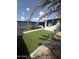 Inviting backyard featuring artificial turf, stone accents and walkways, offering a low-maintenance outdoor space at 1524 E Cortez St, Phoenix, AZ 85020
