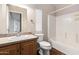 Neutral bathroom featuring a single sink vanity, blinds, and a shower-tub combination at 155 E Rodeo Rd # 64, Casa Grande, AZ 85122
