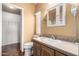 The well-lit bathroom features a vanity and plenty of storage at 155 E Rodeo Rd # 64, Casa Grande, AZ 85122