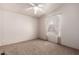 Cozy bedroom with carpet, ceiling fan, and natural light at 155 E Rodeo Rd # 64, Casa Grande, AZ 85122