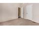 Bedroom featuring carpet, ceiling fan, and access to the closet and bathroom at 155 E Rodeo Rd # 64, Casa Grande, AZ 85122