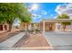 Charming single-story home with a covered carport and a well-maintained front yard at 155 E Rodeo Rd # 64, Casa Grande, AZ 85122