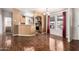 Open-concept living space with wood-look floors, seamlessly connected to the kitchen and dining area at 155 E Rodeo Rd # 64, Casa Grande, AZ 85122