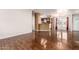 Inviting living room showcasing wood-look flooring and an open floor plan connecting to the kitchen at 155 E Rodeo Rd # 64, Casa Grande, AZ 85122
