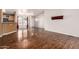 Bright living room area showcasing wood-look floors and seamlessly connected to the kitchen with natural lighting at 155 E Rodeo Rd # 64, Casa Grande, AZ 85122