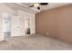 The spacious main bedroom includes a ceiling fan, attached bathroom and walk-in closet at 155 E Rodeo Rd # 64, Casa Grande, AZ 85122