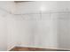 Walk-in closet with white shelving and wood-look floors at 155 E Rodeo Rd # 64, Casa Grande, AZ 85122