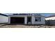 New home construction with a large garage and stacked roof tiles at 15788 W Beryl Ave, Waddell, AZ 85355