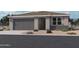 Charming single-story home with a two-car garage and low-maintenance desert landscaping at 15788 W Beryl Ave, Waddell, AZ 85355