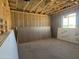 Unfinished living room construction showing insulation and Glasroc drywall at 15788 W Beryl Ave, Waddell, AZ 85355