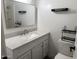 Bright bathroom featuring a modern vanity with a white countertop and a shower-tub combination at 1802 W Frier Dr, Phoenix, AZ 85021