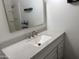 Bright bathroom featuring a modern vanity with a white countertop and a shower-tub combination at 1802 W Frier Dr, Phoenix, AZ 85021