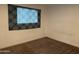 Neutral bedroom featuring ample sunlight and brown carpet at 1802 W Frier Dr, Phoenix, AZ 85021