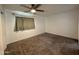 Large bedroom featuring carpeted floors and a ceiling fan at 1802 W Frier Dr, Phoenix, AZ 85021
