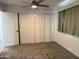 Bedroom featuring carpet, a ceiling fan, and closet at 1802 W Frier Dr, Phoenix, AZ 85021