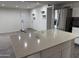 Kitchen island with bright countertop and open view at 1802 W Frier Dr, Phoenix, AZ 85021