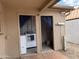 Exterior laundry area features two separate entrances, laundry units, and a functional layout at 1802 W Frier Dr, Phoenix, AZ 85021