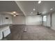 Open-concept living space with recessed lighting, ceiling fans, and blended flooring at 1802 W Frier Dr, Phoenix, AZ 85021