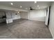 Expansive living space with new carpeting and transitions to vinyl plank flooring at 1802 W Frier Dr, Phoenix, AZ 85021