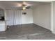 Large open living room with transition between carpet and vinyl flooring at 1802 W Frier Dr, Phoenix, AZ 85021