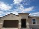 Inviting single-story home with a desert landscape, a two-car garage, and a covered entryway at 18832 E Bruno Dr, Gold Canyon, AZ 85118