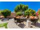 Beautiful backyard featuring brick flooring, outdoor furniture and lush landscaping for ultimate relaxation at 2011 W Calle De Las Estrella --, Phoenix, AZ 85085