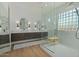 Modern bathroom featuring a dual sink vanity and a glass shower with glass block window at 2011 W Calle De Las Estrella --, Phoenix, AZ 85085