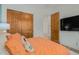 Bright bedroom featuring wood floors and plush bedding with direct access to the closet at 2011 W Calle De Las Estrella --, Phoenix, AZ 85085