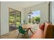 Modern dining area featuring a wooden table, sleek green chairs and a large sliding door to the patio at 2011 W Calle De Las Estrella --, Phoenix, AZ 85085